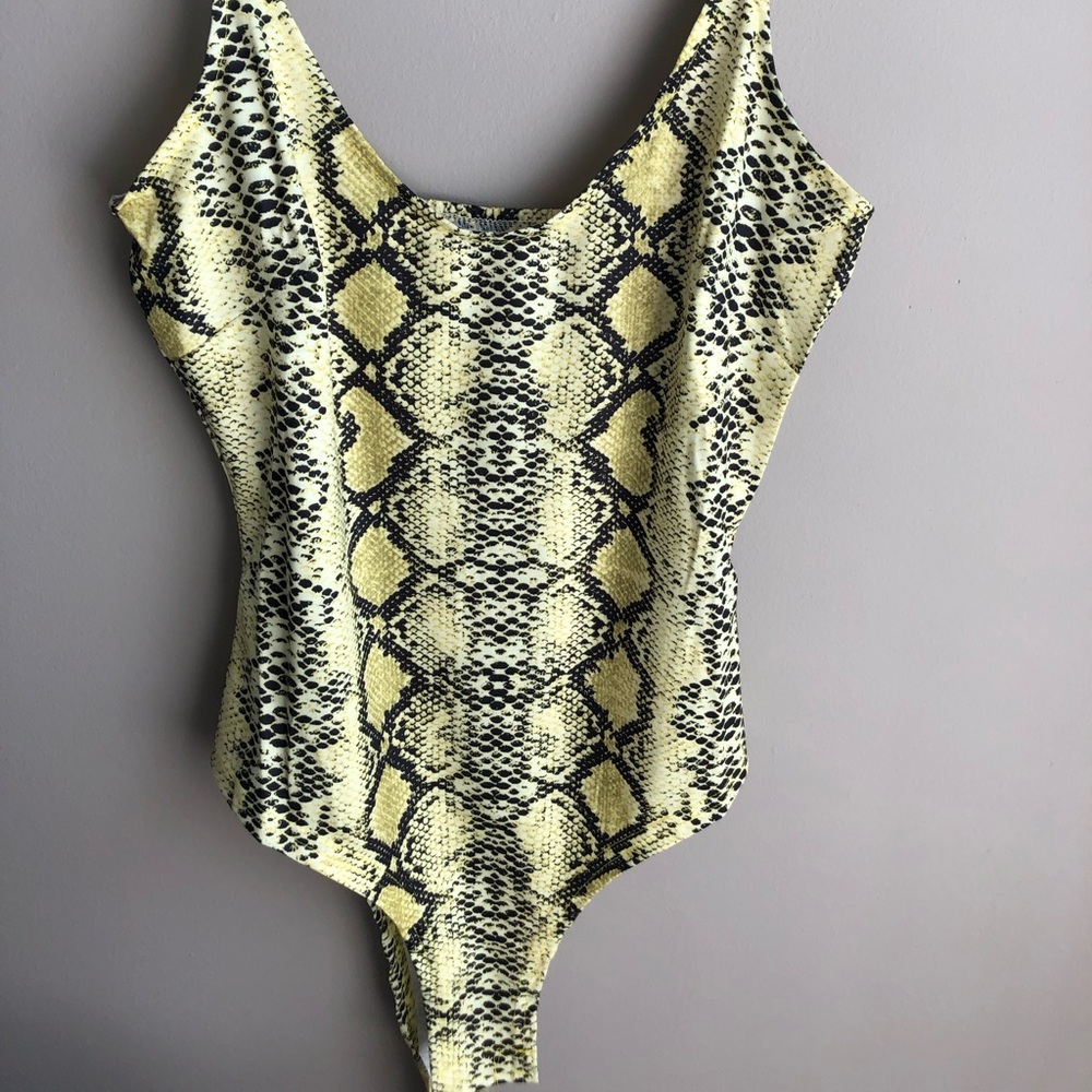 Neon yellow, bodycon snake print bodysuit.